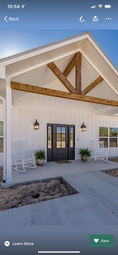 a white house with wooden beams and doors