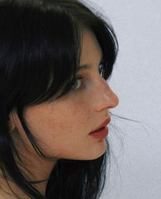 a close up of a woman with black hair