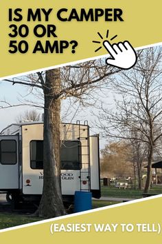 a camper parked next to a tree with the words, is my camper 30 or 50 amp?