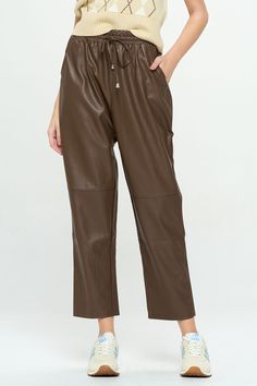 Edgy and comfortable, these faux leather pants feature a relaxed fit, wide, cropped legs, pockets and seams at the knees. An elastic waistband makes them perfect for on-the-go wear or dress them up with a strappy heel and bodysuit. Product Details Material: 50% Polyester, 50% PU; Lining: 100% Polyester. Fit: True to size. Relaxed fit.Length: 28" Inseam; 12" Rise (size Small). Fabric: Structured, woven fabric. Features: Drawstring elastic waistband, pockets, wide leg, soft faux suede interior lin Wide Leg Leather Pants, Argyle Sweater Vest, Rancher Hat, Polo Long Sleeve, Argyle Sweater, Satin Maxi, Satin Maxi Dress, Faux Leather Pants, Cozy Knits