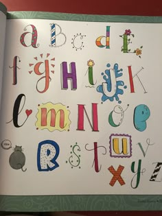 an open children's book with letters and numbers