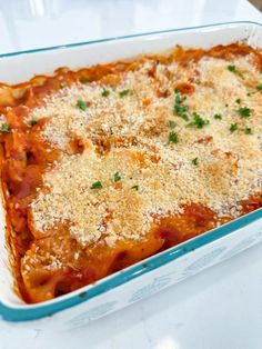 a casserole dish with meat and cheese on top, ready to be eaten