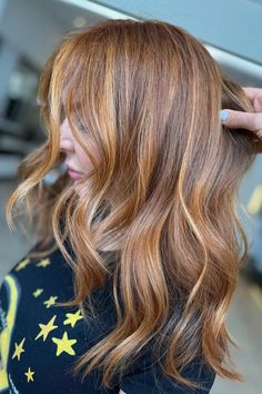 Woman with brown hair featuring vibrant copper highlights. Brown Hair With Copper, Hair With Copper Highlights, Brown Hair With Copper Highlights, Copper Highlights On Brown Hair