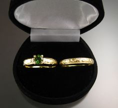 "This beautiful deep river green Tourmaline really goes with the Green Gold! The eye clean stone measures 6mm in diameter and weighs about .90ct. Set with 4mm wide by 1.5mm thick Victorian floral pattern band. Comes with matching 3.2mm wide by 1.5mm thick band. Size 9 ring is pictured for scale. Specify your size in a \"note to seller\" at check out." Deep River, Birthstone Ring Mothers, Green Tourmaline, Bridal Sets, Wedding Ring Sets, Green And Gold, Ring Sets, Tourmaline, Garnet