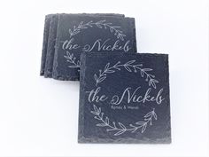 three slate coasters with the words, the nicks and floral designs