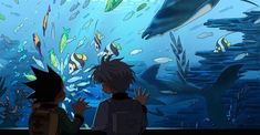 two children looking at an aquarium with fish and other marine life in the water behind them