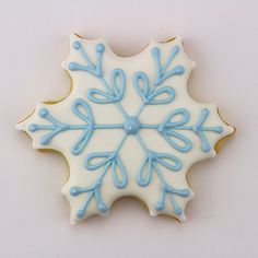 a decorated cookie with blue icing on it