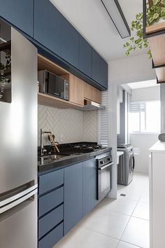 the kitchen is clean and ready to be used as a washer and dryer