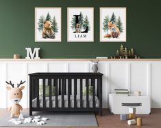 a baby's room with green walls and pictures on the wall, including a crib