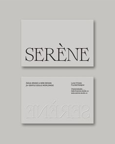 two business cards with black and white lettering on them, one has the word serene in