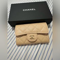 Brand New Chanel Beige With Gold Hardware Flap Coin Purse 100% Authentic Brand New Comes With The Full Set Beige Wallet With Original Box As Gift, Elegant Beige Coin Purse With Card Slots, Classic Beige Compact Wallet, Designer Beige Wallets For Gift, Designer Beige Wallets For Gifts, Designer Beige Wallets As Gift, Classic Compact Beige Wallet, Designer Beige Wallets As A Gift, Chic Beige Wallets Perfect For Gifts