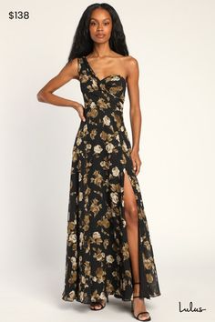 Look like the epitome of style at any soiree this summer with the Lulus Fashionably Refined Black Floral Print One-Shoulder Maxi Dress! This elegant gown is composed of lightweight woven chiffon, decorated with vintage-inspired floral print throughout, that shapes a sweetheart bodice (supported by hidden no-slip strips), while a single gathered wide strap creates a one-shoulder neckline. A high, fitted waist tops a flowy A-line skirt that falls to a maxi hem, accented with a sultry thigh-high si One Shoulder Dressy Evening Dress For Wedding, Glamorous Maxi Dress With Asymmetrical Neckline For Wedding, Elegant Floral Print Evening Dress For Prom, One-shoulder Festive Gown For Gala, Festive One Shoulder Gala Gown, One-shoulder Gown For Gala And Festive Occasions, Glamorous Floral Print Maxi Dress For Wedding, Summer Gown With Asymmetrical Neckline, Fitted One-shoulder Summer Gown