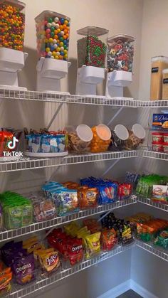 a pantry filled with lots of different types of food and snacks on shelving units