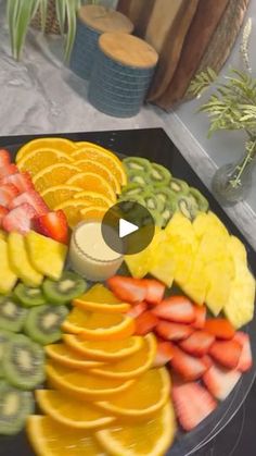 a platter filled with sliced fruit and vegetables