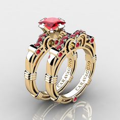 two gold wedding rings with red stones on each one and the words love is in between them