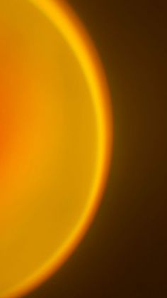 a blurry image of an orange and yellow object