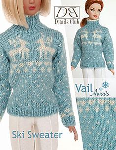 the doll is wearing a blue sweater and pants with white snowflakes on it