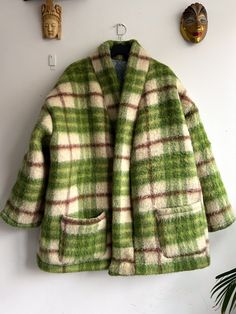 Elevate your wardrobe with the handmade Oversized Wool Coat! 🍃 Handcrafted from a vintage green checkered Dutch woolen blanket, this cozy masterpiece brings together warmth, style, and sustainability. Imagine wrapping yourself in the soft embrace of chunky wool, with a touch of nostalgia from the blanket's history. 🧥✨ Key Features: ✂️ Handmade with love 🌍 Upcycled vintage Dutch wool 🧣 Oversized for ultimate comfort 🌈 Green checkered pattern ♻️ Lined with leftover fabric for a unique twist (cotton and polyester) 📦 Two spacious pockets for practicality Sizing: Size Medium, but can also be worn with size Large cause it's an oversized fit. I wear it in the pictures with size Small.  You might also like: https://www.etsy.com/shop/ReggieTheLabel?section_id=19719159 Instagram: https://www.i Oversized Green Wool Outerwear, Woolen Blanket, Oversized Wool Coat, Blanket Jacket, Woollen Blankets, Green Checkered, Leftover Fabric, Chunky Wool, Green Coat