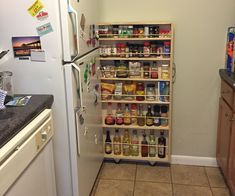 a kitchen with a refrigerator filled with lots of food and condiments on the shelves