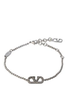 Find VALENTINO Vlogo Signature Crystal Bracelet on Editorialist. Maximum length: 21cm. Minimum length: 18cm. Silver-plated brass. Crystal. Logo detail. Adjustable clasp closure with logo detail Designer Jewelry Bracelet With Logo Charm, Elegant Silver Bracelet With Logo Charm, Designer Logo Charm Bracelet Jewelry, Luxury Chain Bracelet With Logo Charm, Designer Metal Bracelets With Logo Charm, Silver Metal Jewelry With Logo, Silver Metal Jewelry With Metal Logo, Elegant Metal Chain Bracelet With Logo Charm, Luxury Silver Jewelry With Metal Logo