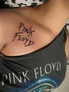 a woman with pink floyd tattoos on her chest