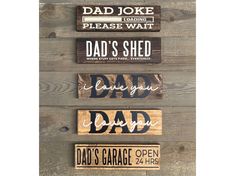 four wood signs that say dad's shed, dad's garage, and dad's garage