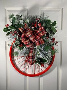 a christmas wreath hanging on the front door