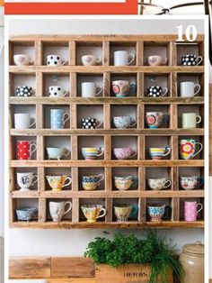 a wooden shelf filled with lots of cups