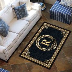 a living room filled with furniture and a rug on the floor