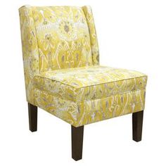 an upholstered yellow chair with black legs