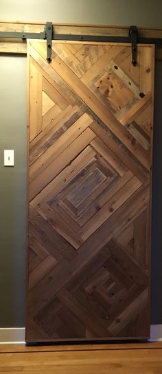 a wooden door with metal hardware on the side