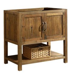 a wooden cabinet with two doors and a basket on the bottom shelf next to it