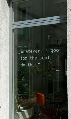 an orange chair sitting in front of a window with the words whatever is good for the soul, do that