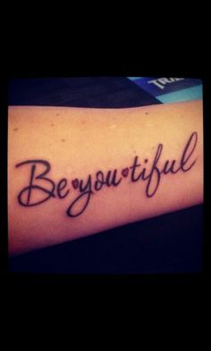 a tattoo with the words be you tiful written in cursive writing on it