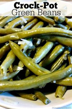 some green beans on a white plate with the words crock - pot green beans