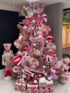 a christmas tree decorated with lollipops, candy canes and candies