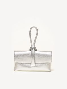 The bag of the season is here. The Francesca is a convertible clutch that's simple, elegant, and undeniably fun. Loop the tubular strap around your wrist and keep your hands free (for a glass of Prosecco, perhaps?). Silver Clutch, Handbag Collection, Wedding Purse, Metallic Foil, Metallic Leather, Clutch Purse, Leather Clutch, Clutch Handbag, Hands Free