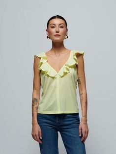 We've never met a ruffle detail we didn't love. Featuring a fluttery ruffle neckline and a chic front seam, this is the flirty tank that pairs well with warm breezes and an ice-cold spritz. (This one comes in Nectar.) | Women's Neah Tank Top in Nectar | Ethical Essentials Chic Flutter Sleeve Top With Ruffles, Chic Tops With Ruffle Hem And Ruffled Straps, Chic Tops With Ruffle Hem And Straps, Chic Tops With Ruffled Straps And Ruffle Hem, Chic Spring Top With Ruffled Straps, Chic Top With Ruffled Straps, T Love, Tank Top, Tank Tops