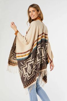 Elevate your outfit with our Luzia Aztek Wrap with Fringe! This versatile open front wrap is perfect for all sizes and adds a touch of boho chic with its fringe details. You'll be turning heads wherever you go! One Size Bohemian Beige Wrap, Bohemian One Size Beige Wrap, One Size Beige Bohemian Wrap, One-size Beige Bohemian Wrap, Bohemian Beige Wrap Shawl, Bohemian Festival Outerwear With Beaded Fringe, Beige Bohemian Shawl With Fringe, Bohemian Beige Shawl With Fringe, Bohemian Beige Outerwear With Tassels