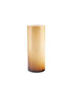 a tall glass vase sitting on top of a white table