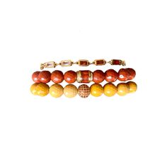 Earthy glam bead bracelet set with a mix of golden yellow Mookaite and deep orange mountain jade beads, featuring orange pave accents. The bracelets are paired with a colorful gemstone bracelet! 2 stretch bracelets, 1 adjustable gemstone bracelet 14k Gold Chain Fits a 6 3/4"-7 1/4" Wrist Adjustable Orange Gemstone Bracelets, Adjustable Orange Natural Stone Beaded Bracelets, Adjustable Orange Beaded Bracelets With Natural Stones, Adjustable Orange Gemstone Bead Bracelet, Adjustable Amber Beaded Bracelets With Faceted Beads, Adjustable Amber Faceted Beaded Bracelets, Adjustable Amber Gemstone Bracelets, Adjustable Amber Bracelet With 8mm Beads, Adjustable Beaded Amber Stretch Bracelet