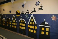 a decorated wall with santa's sleighs and snowflakes on it