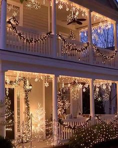 christmas lights decorate the front porch of a house