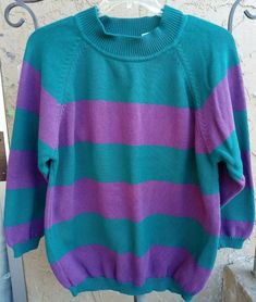 This is a very nice pre-owned "Vintage" long sleeve, mock turtleneck style collar pullover sweater.  It is a size large and is made by Honors Apparel.  It is purple and teal green in color. This sweater has wide purple and green stripes across the entire sweater.  The collar, cuffs, and bottom of the sweater are all ribbed.   PLEASE NOTE:  This sweater is vintage from the late 80's, early 90's.  It has been lovingly worn.  There is a very small spot about 1/8" at the most on the lower center fro Purple And Blue Outfit, 80s Preppy Fashion, Preppy Images, Slasher Aesthetic, 80s Slasher, Teal Outfit, Purple Clothes, Thrift Wishlist, 80s Clothes