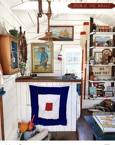 a room filled with furniture and pictures on the wall