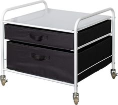 two black and white storage drawers on wheels with casteors, one for the baby's diaper