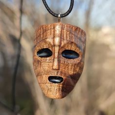 * This wooden face mask pendant is made entirely of natural walnut wood. * Handmade wooden mask necklace will be a wonderful and unique gift for yourself and your boyfriend. *  Wooden mask charms It will be a great gift for wood lovers. * 2mm special necklace rope is used on the necklace. You can be sure that it is very light and will not disturb you when it touches your skin. * At the end of the necklace rope, there is a small hook with a button to easily take off and put on your necklace. Than Sculpture Dremel, Streetwear Necklace, Punk Mask, Art Sculpture En Bois, Wood Jewelry Diy, Hand Carved Jewelry, Wood Carving Faces, Dremel Carving, Wooden Mask