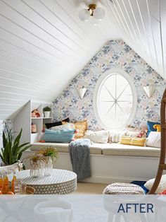 an attic bedroom with white walls and floral wallpaper on the ceiling, window seat in the corner