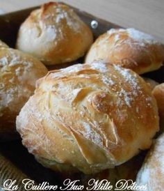 some bread rolls are sitting in a bowl