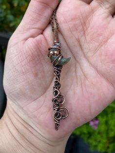 Labradorite Small Moon Key (Blues and greens, flashy) Pendant wire wrapped in Oxidized Copper This is an Labradorite Small Moon Key Pendant. Wrapped in a elegant key design with swirls copper design that has been oxidized. It has been polished and will need a good polish every once and a while. This is the only one of its kind. Comes with a chain to match the copper color. Will have a polish cloth in the box and sealed ready for gift giving. Makes a great gift or something to treat yourself! Very nice necklace. It will come in a box ready to be given as a gift. Thank you for visiting MunchkinsCreationsCA Gemini Jewellery part of the Wings and Things Shop! Wire Wrapped Key Pendant, Handmade Magical Green Jewelry, Handmade Magical Style Green Jewelry, Hand Wrapped Green Necklace As Gift, Green Hand Wrapped Necklace For Gift, Hand Wrapped Green Necklace For Gift, Gemini Jewelry, Wire Wrapped Chain, Copper Design